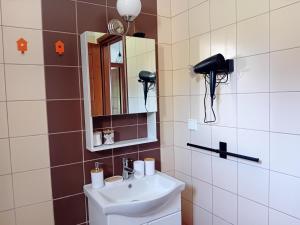 a bathroom with a sink and a mirror at Κτήμα Verde in Agia Paraskevi +73 photos