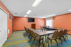 a conference room with tables and chairs and a tv at Sleep Inn Beaufort near MCAS in Beaufort +44 photos