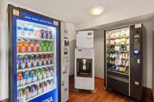 a soda vending machine next to a drink cooler at Sleep Inn Beaufort near MCAS in Beaufort