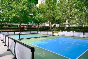 a tennis court with a net on top of it at JW Marriott Hotel Beijing in Beijing