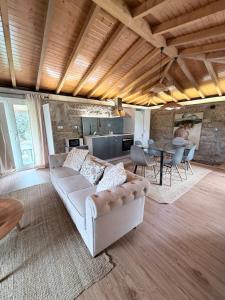 a living room with a couch and a table at Pedacinho do Céu in Vieira do Minho