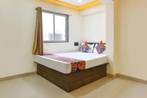 a bedroom with a bed in a room at FabHotel Silver Star in Pune +27 photos