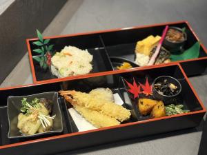 two boxes filled with different types of food at Hotel Noir Blanc in Shizuoka +34 photos