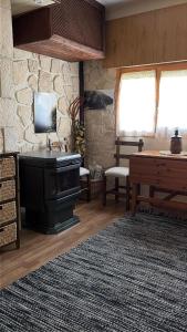 a living room with a sink and a table at Apartamento Selva Blanca 9 in Villanúa +19 photos