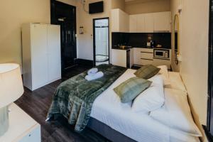 a bedroom with a large bed with a teddy bear on it at Glebe Terraces in Sydney