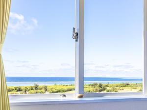 an open window with a view of the ocean at Comfort Hotel ERA Ishigaki Island in Ishigaki Island +51 photos