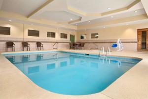 a large swimming pool in a hotel room at Country Inn & Suites by Radisson, Albany, GA in Albany +45 photos