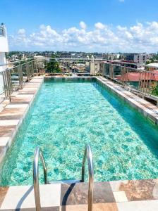 a large swimming pool on top of a building at TchaoPremium in Lomé