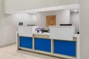 an office lobby with blue and white counters at Comfort Inn & Suites Tyler North in Tyler