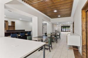 an office with tables and chairs in a cafeteria at Comfort Inn & Suites Tyler North in Tyler
