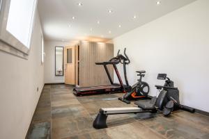 a gym with two exercise bikes in a room at Gîte Perce Neige, Spa, Sauna in Gerbépal