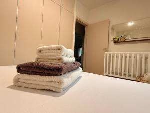 a stack of towels sitting on top of a table at Nicosia Neoclassic Retreat in Nicosia +23 photos