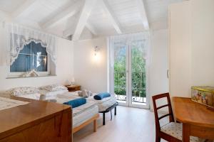 a living room with two couches and a table at Anika’s Home in Valfloriana