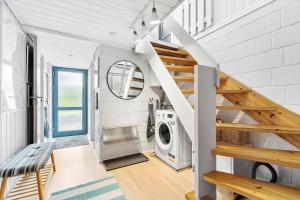 a laundry room with a washer and dryer at 8528-Grenaa-Klitten-28 in Grenå
