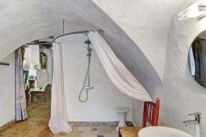 a bathroom with a shower with a shower curtain at Ferienhaus Stadlerhof in Rettenschöss +37 photos