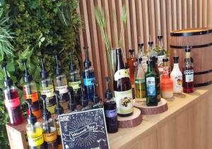 a bunch of bottles of alcohol sitting on a shelf at Super Hotel Kushiro-Ekimae in Kushiro +88 photos