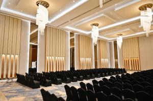 an empty room with chairs and tables in it at ACASA Collective in Aurangabad