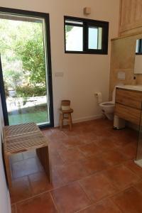 a bathroom with a toilet and a sink at La Vilo Dòu Verdon in Roumoules +30 photos