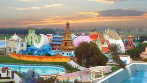 a view of a amusement park at sunset at MSG Hotels And Resort in Sirsa
