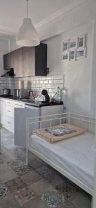 a kitchen with a bed in a room at Sea home Asprovalta in Asprovalta