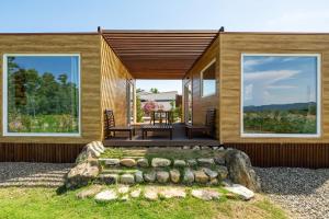 a house with a view of the front yard at Macondo Agriliving Tiny Houses in Castiadas