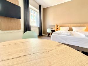 En eller flere senge i et værelse på Hotel am Kieler Schloss by Première Classe
