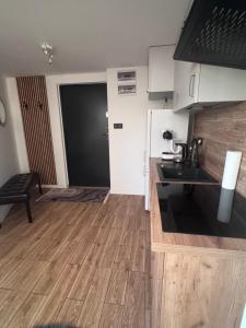 a kitchen with a sink and a counter top at Hostel Suchedniów in Suchedniów
