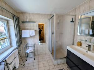 a bathroom with a shower and a sink at Ferienwohnung Jodlschmid in Ruhpolding
