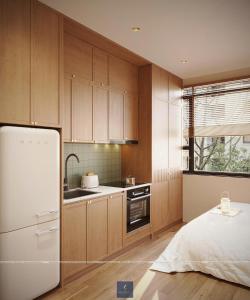 a kitchen with wooden cabinets and a white refrigerator at Urban Nest in Hanoi +17 photos