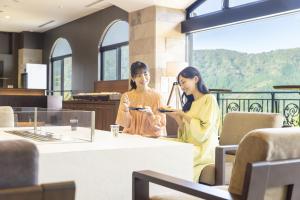 two women sitting at a table in a room at TAOYA Hakone in Hakone