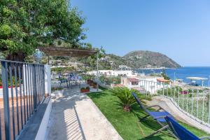 a balcony with chairs and a view of the ocean at Villa Grazia Lipari in Lipari