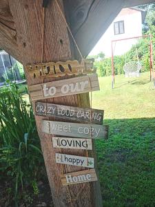a sign that says hello to our car key liquidancy and sweet cozy happy home at Tiski raj in Bečej