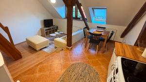 a living room with a kitchen and a dining room at Apartmány v Žitě in Třeboň