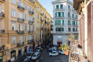 an overhead view of a city street with parked cars at B&B A Durmì in Naples