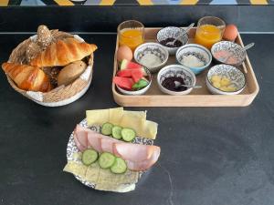 two trays of food with different types of food at Bed en Brood Prunushof in Zelhem