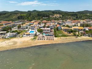 an aerial view of a beach with a town at The Kavos Sandy Inn in Kavos