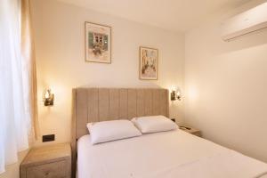 a bedroom with a bed with two white pillows at Villa President 3 in Krimovice +40 photos