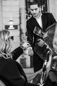 a woman is handing a man a car at Villas Foch Boutique Hotel & Spa Bordeaux in Bordeaux +115 photos