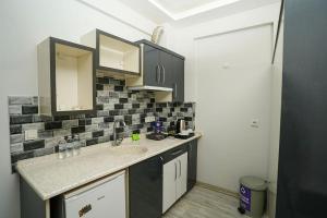 a kitchen with a sink and a counter top at Tk Residence in İzmir +16 photos