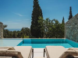 a swimming pool in a villa with a view at Doci Kelios - Serenity Suites with Private Heated Pools, by ZanteWize in Agios Nikolaos