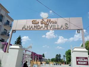 a sign for the entrance to the amazon anaheim at The saffron anandamvillas in Kurukshetra