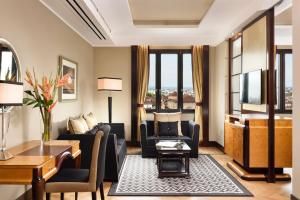 a living room with a couch and chairs and a table at Principi di Piemonte | UNA Esperienze | Preferred Hotels and Resorts in Turin