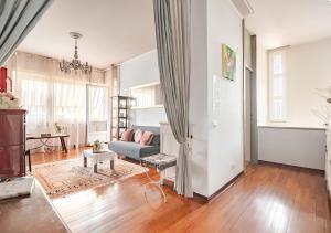 a living room with a couch and a table at B&B La Casa di Pamela - 5 min Lago Varese in Varese