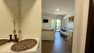 a living room with a couch and a table in a room at Neo3 in Veliko Gradište +8 photos