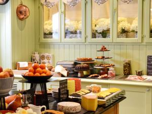 a buffet with many different types of food on display at Le Royal Hotel Lyon - MGallery Collection in Lyon +57 photos