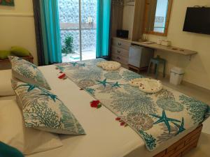 a bedroom with a bed with two pillows on it at Dream Inn at Thulusdhoo in Thulusdhoo +27 photos