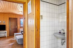 a bathroom with a sink and a toilet in a room at Bergpanorama Ruhla in Ruhla +109 photos