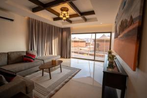 a living room with a couch and a table at Valley Resort in Wadi Rum