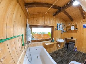 a bathroom with a tub and a sink at Ćićkova Čarda in Ulcinj +46 photos