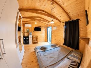 a bedroom in a tiny house with a bed at Ćićkova Čarda in Ulcinj